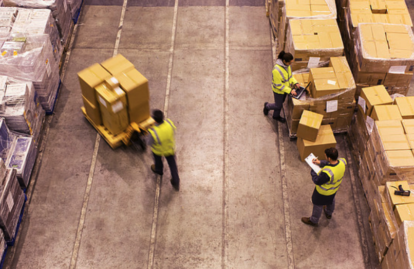 Warehouse Workers Moving Boxes