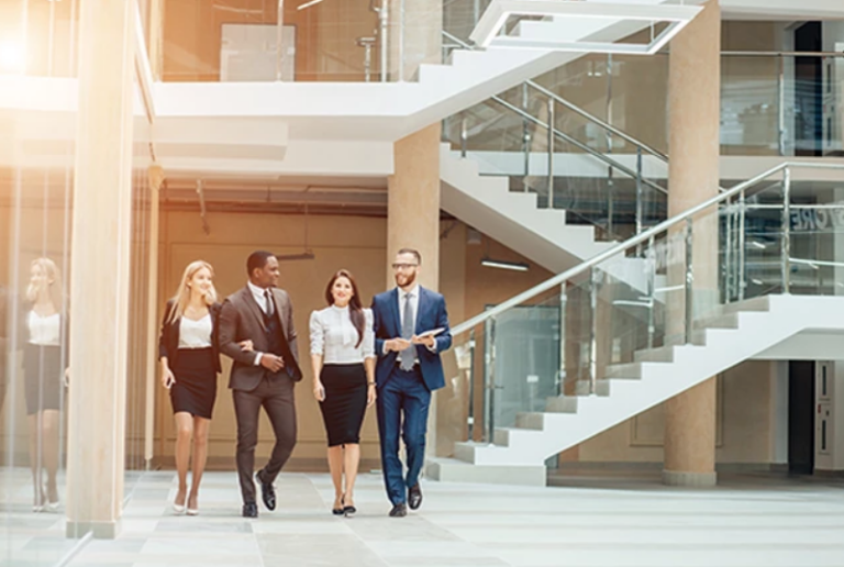 Business People Walking Through Building