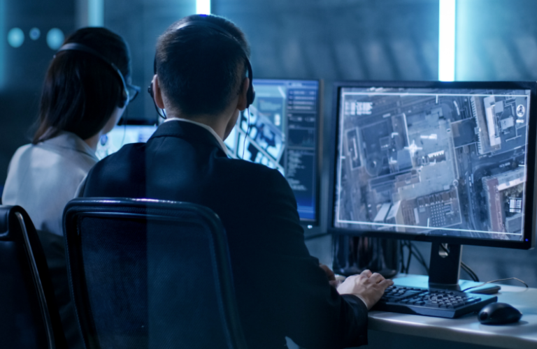 Security Workers Looking at Surveillance Screens