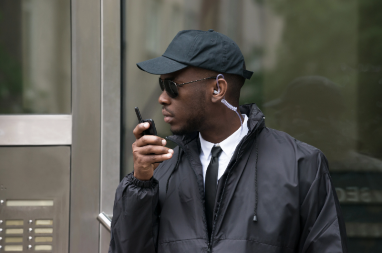 Security Officer Speaking Into Two-Way Radio