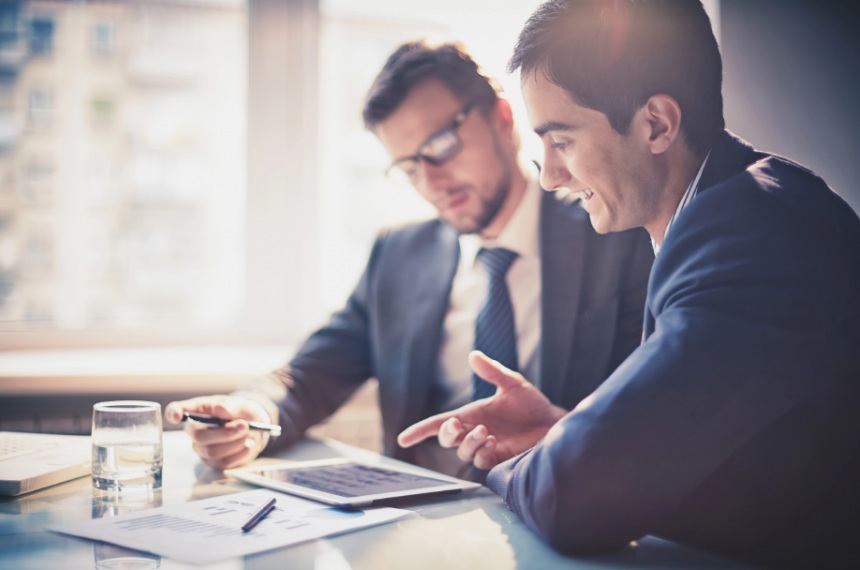 Two Businessmen Reviewing Document